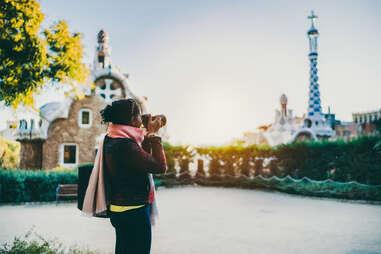 woman takes photo of barcelona art in winter