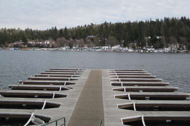 dock at lake arrowhead with snowy mountains behind