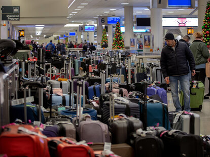 Stranded travelers search for their luggage during the holiday season in 2022.