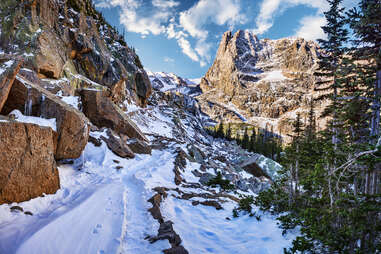 snowy trail, winding through, rocky mountain national park, in colorado