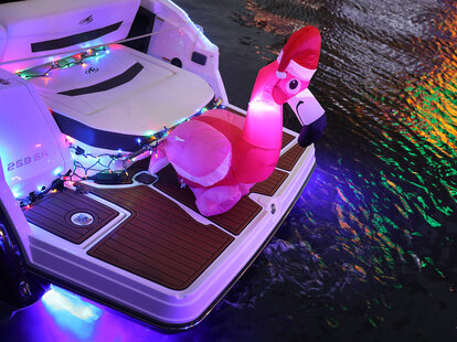 boat decked out with a flamingo in a santa hat, at the fort lauderdale parade