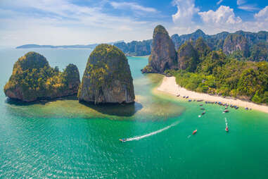 ko phi phi thailand, aerial shot, with boat heading to the water