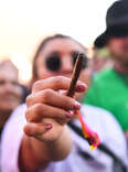 woman with joint at cannabis festival 