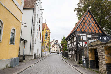 street running, past a cafe, visby, sweden