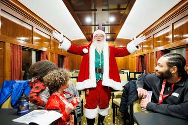 santa with kids on a train