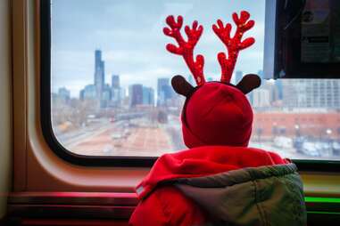 kid looking out the window of a cta train