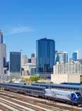 Skyline with Amtrak Midwest passenger train railway near Union Station in Chicago, United States.