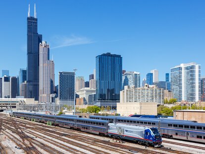 Skyline with Amtrak Midwest passenger train railway near Union Station in Chicago, United States.