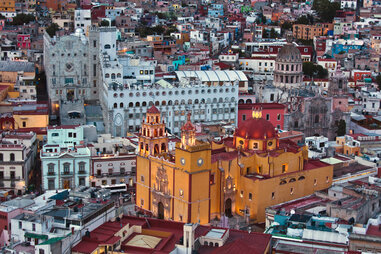 Basilica Colegiata de Nuestra Senora glows at sunset in Guanajuato, Mexico