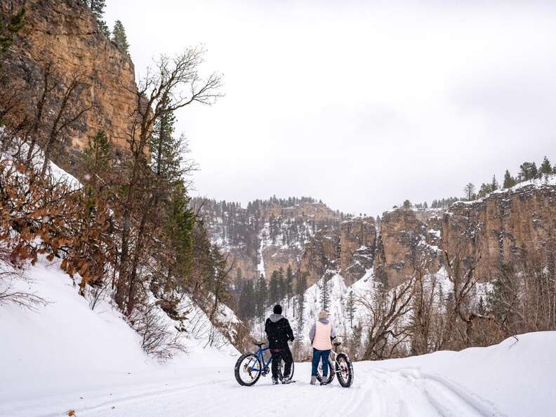 couple winter snow biking at Spearfish Canyon Lodge