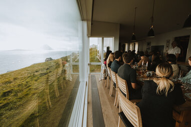a group eating at a supper party in the faroe islands