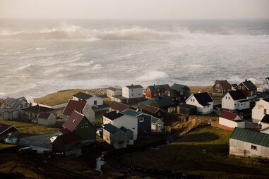 aerial shot of an array of colorful seaside homes on the faroe islands