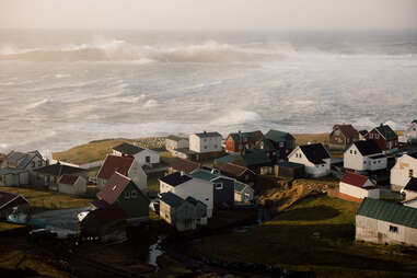 aerial shot of an array of colorful seaside homes on the faroe islands
