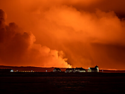 A view of the Bessastadir, the official residence of President of Iceland as volcano spews lava and smoke as it erupts in Grindavik, Iceland, December 18, 2023.