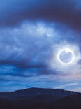 The Totality Solar Eclipse a double exposed image shot with the Blue Ridge Mountains in North Carolina.