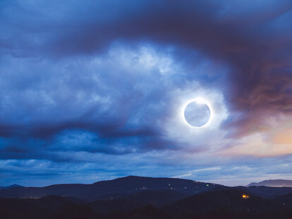 The Totality Solar Eclipse a double exposed image shot with the Blue Ridge Mountains in North Carolina.