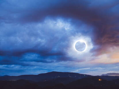 The Totality Solar Eclipse a double exposed image shot with the Blue Ridge Mountains in North Carolina.