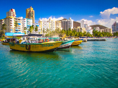 Bright port of Rodadero, in Santa Marta, Colombia with touristic boats and Caribbean sea.