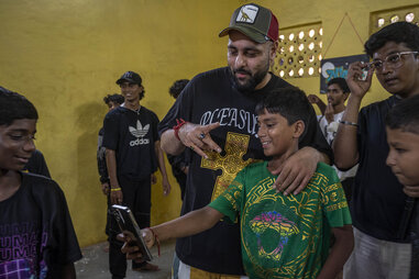 a bollywood star poses for a selfie with a young fan and aspiring actor in india