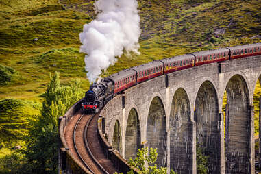 jacobite steam train passing over glenfinnan viaduct 