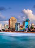 San Juan, Puerto Rico resort skyline on Condado Beach on dusk.