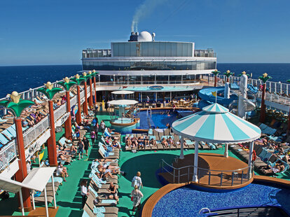 The pool deck of the cruise ship Norwegian Gem is busy as passengers enjoy their first day at sea on their cruise to Bermuda.