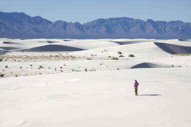 Woman hiker explores White Sands National Monument New Mexico mountains