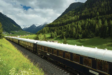 venice simplon orient express riding through hills of austria