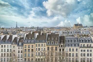 parisian buildings with eiffel tower in the background