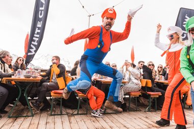 people in super mario costumes