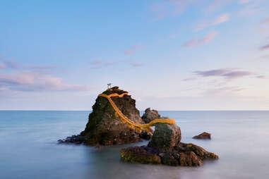 meoto iwa rock surrounded by morning clouds