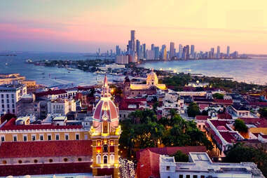 aerial shot of cartagena, colombia at sunset showing the old and new city