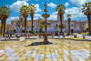 plaza de armas in arequipa, peru with cathedral and fountain
