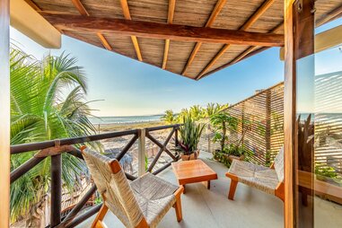 beach view from balcony of casa kuaa hotel room