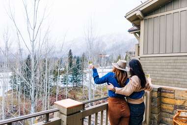 two women with champagne at Four Seasons Resort and Residences Jackson Hole, wyoming