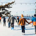 couple holding hands while iceskating in newport, rhode island