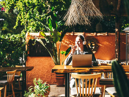 Woman working at a Bali style cafe in Turkey