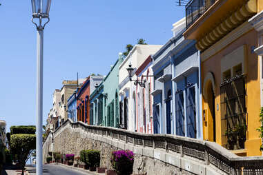 a colorful street facade on a slope in mazatlan mexico