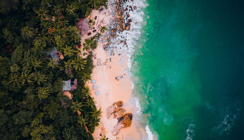 aerial shot of a beautiful secluded, empty beach with turquoise water in Puerto Vallarta, Mexico 