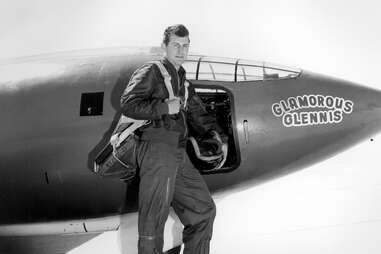 chuck yeager stands in front of the glamorous glennis supersonic jet