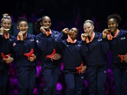 First-placed USA’s team celebrate with their gold medals during the podium ceremony after competing in the Women’s team final event during the World Gymnastics Championships in Liverpool, northern England on November 1, 2022.