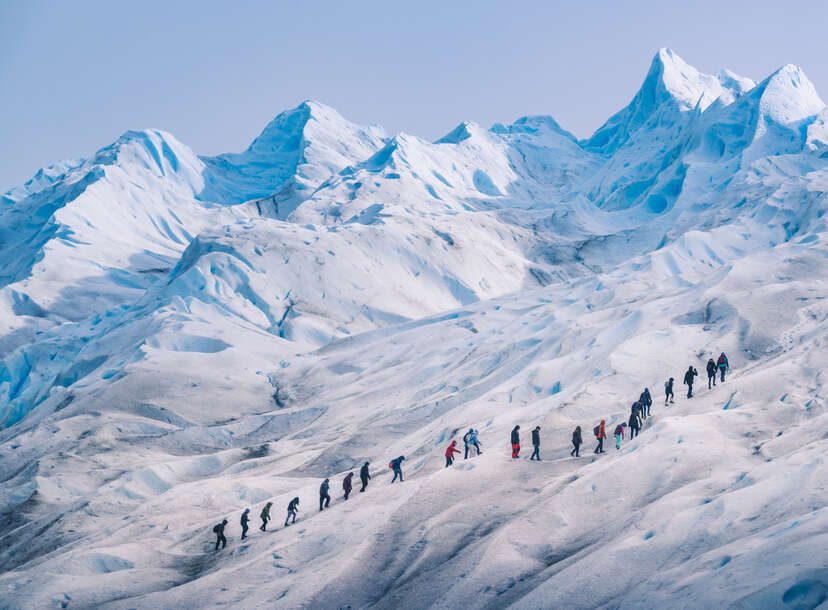 People hiking in a row on the ice of Perito Moreno glacier, Los Glaciares national park, Santa Cruz province, Patagonia Argentina