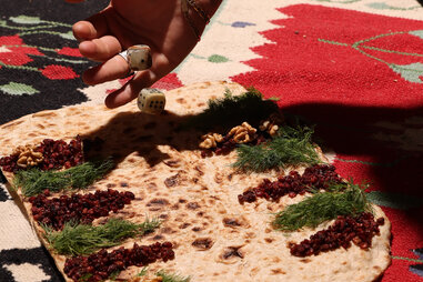 rolling dice on a makeshift backgammon board at silver lake backgammon club in LA