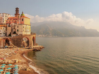 The beautiful Amalfi town with shoreline during golden hour during summer in Italy. -