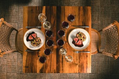 casa vigil mendoza dining table with dishes