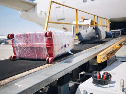 suitcase plastic wrap airport