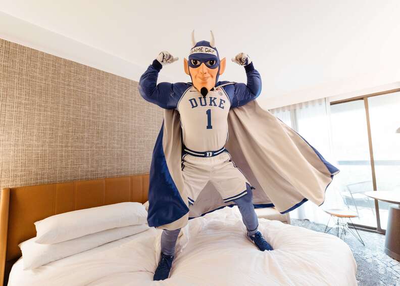 professional basketball players in cramped budget hotel rooms with luggage conceptual illustration