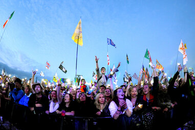 looking at a concert crowd leaning over a barrier