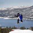 snowboarder on a jump over big bear lake in southern california