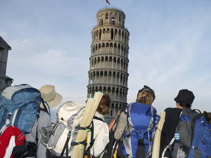 tourists in front of the leaning tower of pisa italy